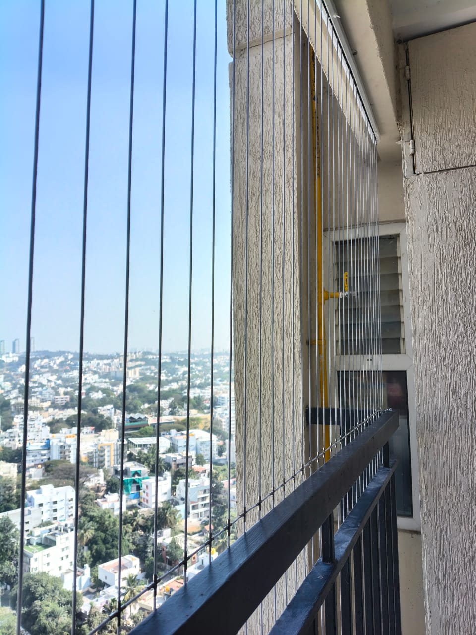 Modern stainless steel invisible grill on a balcony